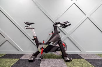 an exercise bike parked in a home gym at 310 at Nulu Apartments-Student, Louisville, KY 40202